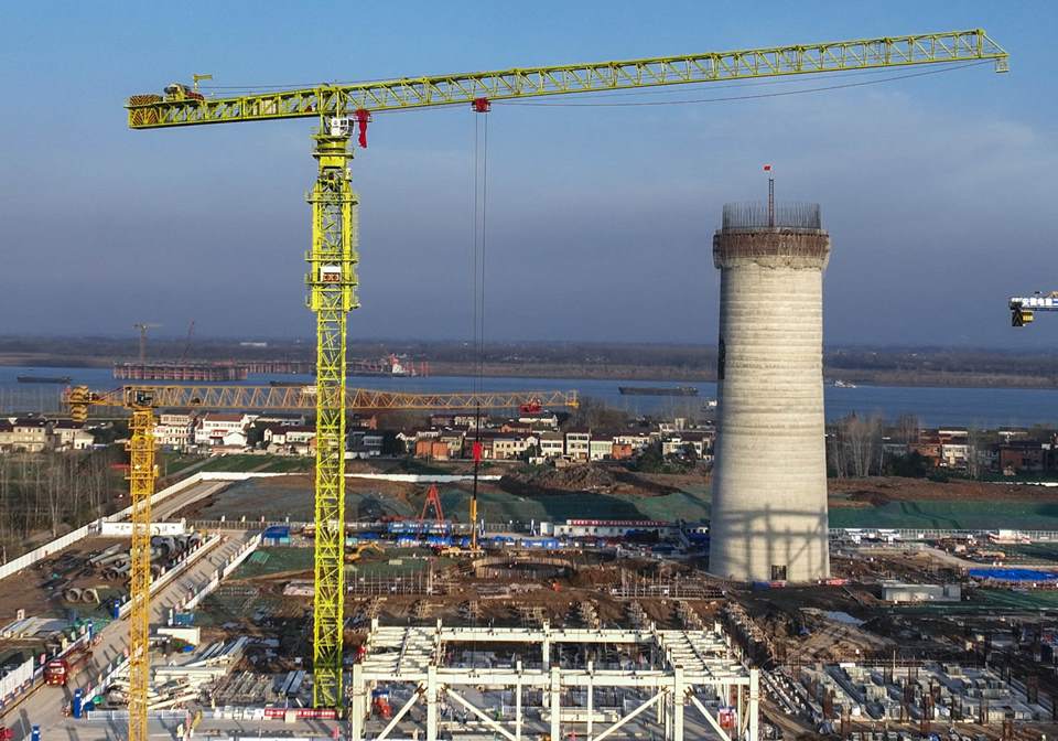 thermal power project showing large smokestacks and industrial structures in operation